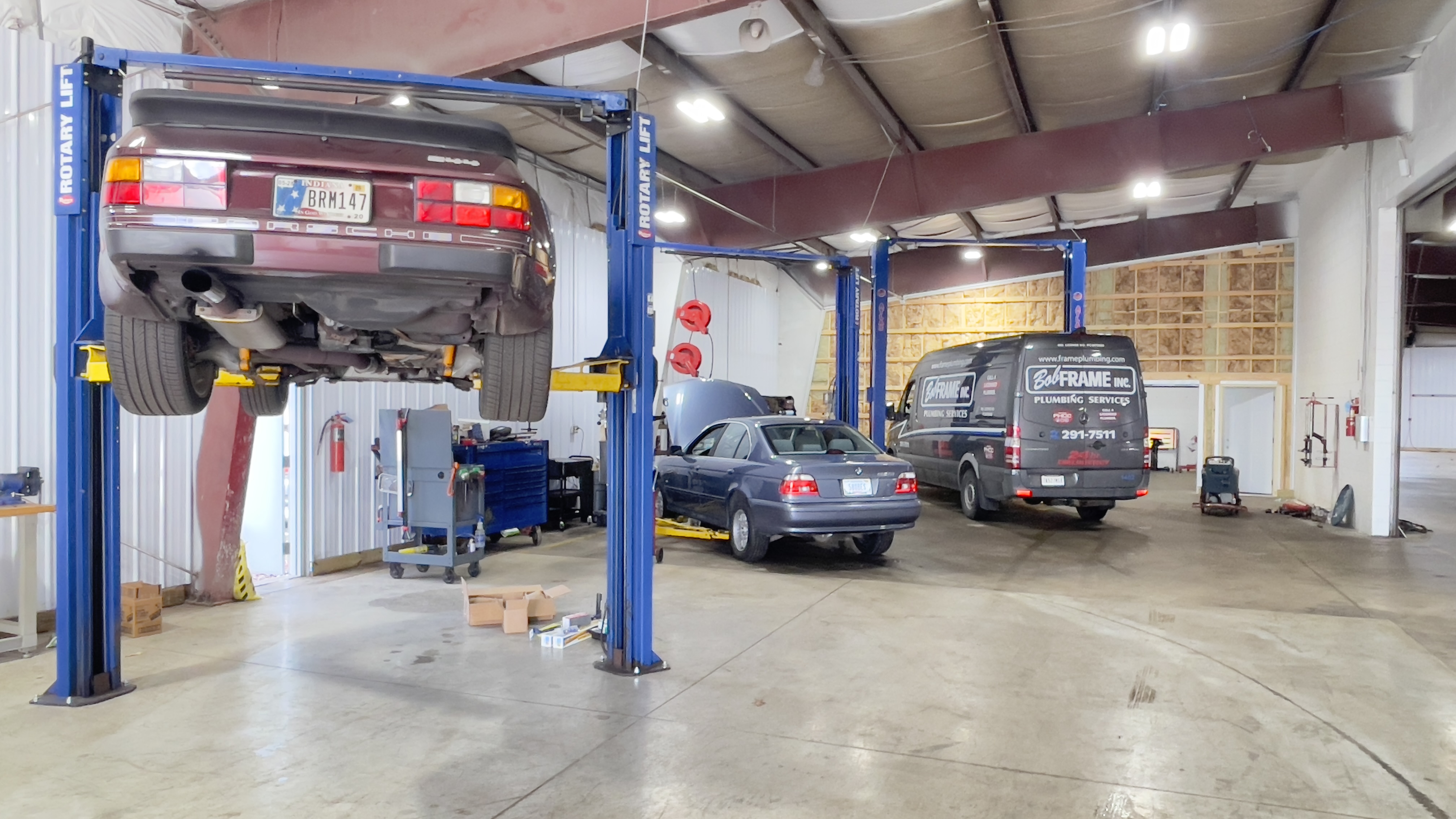 Sprinter van on lift for inspection at Benz Tech